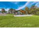Open-air pavilion with a picnic area on a grassy lawn at 4840 Depew St, Denver, CO 80212