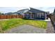 Backyard featuring a lawn, privacy fence, and a patio with a dining set and grill at 719 S Hoover Ave, Fort Lupton, CO 80621