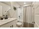 Clean bathroom with modern fixtures and neutral finishes with tub and shower combo at 719 S Hoover Ave, Fort Lupton, CO 80621