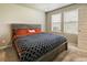 Comfortable bedroom with natural light and modern decor with en-suite bath at 719 S Hoover Ave, Fort Lupton, CO 80621