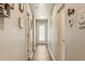 Bright hallway with hardwood floors, neutral paint, and doors leading to multiple rooms at 719 S Hoover Ave, Fort Lupton, CO 80621