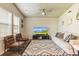 Relaxing living room featuring wood flooring, modern furniture, and lots of light at 719 S Hoover Ave, Fort Lupton, CO 80621