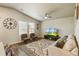Warm living room featuring vaulted ceiling, with modern decor and lots of light at 719 S Hoover Ave, Fort Lupton, CO 80621