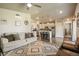Bright living room with lots of natural light, modern rug, and neutral decor at 719 S Hoover Ave, Fort Lupton, CO 80621