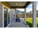 Covered patio with a grill and outdoor seating area, overlooking the backyard at 719 S Hoover Ave, Fort Lupton, CO 80621