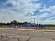 Exterior view of a school sign, welcoming students and visitors to the home of the Blue Devils at 719 S Hoover Ave, Fort Lupton, CO 80621