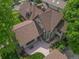 Aerial view of a well-maintained roof, patio, and backyard surrounded by lush trees, creating a private oasis at 1731 S Ogden St, Denver, CO 80210