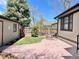 Outdoor patio area for relaxing or entertaining, surrounded by a well-maintained yard at 1731 S Ogden St, Denver, CO 80210