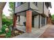 Brick patio with overhead awning, and landscaped yard, ideal for outdoor entertaining at 1731 S Ogden St, Denver, CO 80210