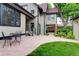 Charming backyard patio with seating and a small patch of lawn, offering a perfect outdoor living space at 1731 S Ogden St, Denver, CO 80210