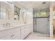 Elegant bathroom featuring a glass enclosed shower and double vanity at 1731 S Ogden St, Denver, CO 80210
