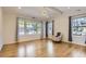 Bright bedroom with hardwood floors, lots of light and neutral colors create a serene atmosphere at 1731 S Ogden St, Denver, CO 80210