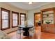 Bright dining area featuring hardwood floors, large windows, and stylish decor at 1731 S Ogden St, Denver, CO 80210