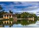 Distant exterior view of a building next to a lake at 1731 S Ogden St, Denver, CO 80210