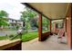 Inviting front porch with brick columns, a swing, and a view of the street at 1731 S Ogden St, Denver, CO 80210