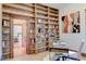 Inviting home office with built-in bookshelves, hardwood floors, and stylish decor at 1731 S Ogden St, Denver, CO 80210