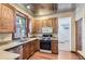 Charming kitchen boasts stainless steel appliances, granite countertops, and ample cabinet space at 1731 S Ogden St, Denver, CO 80210
