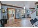 Bright and airy living area with hardwood floors, ample seating, and decorative artwork at 1731 S Ogden St, Denver, CO 80210