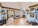 Open-concept room featuring wood trim, many windows and hardwood floors at 1731 S Ogden St, Denver, CO 80210