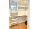 Spacious walk-in closet featuring built-in shelving and ample storage space at 1731 S Ogden St, Denver, CO 80210