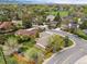 Residential area with mature trees, well-maintained lawns, and mountain views in the distance at 3229 Swadley St, Wheat Ridge, CO 80033