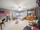 Cozy carpeted bedroom featuring eclectic decor and furniture with a ceiling fan at 3229 Swadley St, Wheat Ridge, CO 80033