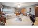 Comfortable carpeted bedroom featuring a ceiling fan, closet and vintage wood furniture at 3229 Swadley St, Wheat Ridge, CO 80033