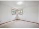 Bright bedroom with multiple windows and neutral carpeting, creating a peaceful retreat at 3229 Swadley St, Wheat Ridge, CO 80033