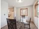 Cozy dining area with a bright bay window, providing a pleasant space for meals at 3229 Swadley St, Wheat Ridge, CO 80033