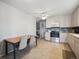 Functional kitchen featuring appliances and a dining area, perfect for casual meals and gatherings at 3229 Swadley St, Wheat Ridge, CO 80033