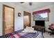 Cozy bedroom with ensuite bathroom access and wood floors at 35877 Elkridge Run, Elizabeth, CO 80107