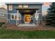 Covered back porch with stylish seating at 19067 W 57Th Dr, Golden, CO 80403