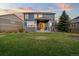 View of the house from the spacious backyard at 19067 W 57Th Dr, Golden, CO 80403