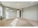 Large, well-lit bedroom with neutral carpet and shelving at 19067 W 57Th Dr, Golden, CO 80403