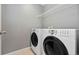Laundry room featuring appliances and a storage shelf at 19067 W 57Th Dr, Golden, CO 80403