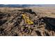 Yellow mountain bike on rocky terrain with scenic mountain views in the background at 19067 W 57Th Dr, Golden, CO 80403