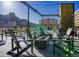 Relaxing rooftop patio with lounge seating and views of the surrounding landscape at 19067 W 57Th Dr, Golden, CO 80403