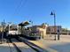 Modern train at Union Station with blue skies, street lamps and bike racks at 19067 W 57Th Dr, Golden, CO 80403