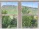 Beautiful park and mountain views from the double windows at 19067 W 57Th Dr, Golden, CO 80403