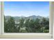 Window view showcasing stunning mountain scenery at 19067 W 57Th Dr, Golden, CO 80403