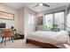 Bright bedroom with large windows, ceiling fan, and room for workspace at 1333 Elati St # 3, Denver, CO 80204