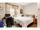 Cozy bedroom featuring natural light, hardwood floors, and a comfortable bed; inviting and peaceful at 1333 Elati St # 3, Denver, CO 80204