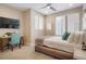 Bedroom with a desk, chair, TV, carpet floors, a ceiling fan, a mirror and a large window at 1333 Elati St # 3, Denver, CO 80204