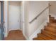 Tiled entry with wooden stairs and a modern metal handrail at 1333 Elati St # 3, Denver, CO 80204