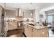 Open kitchen with island, stainless appliances, and modern cabinets; inviting space for cooking and entertaining at 1333 Elati St # 3, Denver, CO 80204