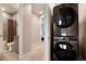 Upstairs laundry closet with modern appliances and views into the bathroom and bedroom at 1333 Elati St # 3, Denver, CO 80204