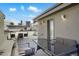 Inviting rooftop deck with comfortable seating, city views, and string lights at 1333 Elati St # 3, Denver, CO 80204