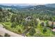 Scenic mountain home surrounded by trees, featuring beautiful views and a serene natural setting at 7273 Silverhorn Dr, Evergreen, CO 80439