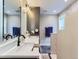 Modern bathroom featuring dual sinks, a large mirror with lighting, and a sleek design, perfect for relaxation at 7273 Silverhorn Dr, Evergreen, CO 80439