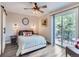 Bright bedroom with a large window providing natural light and access to a private balcony at 7273 Silverhorn Dr, Evergreen, CO 80439